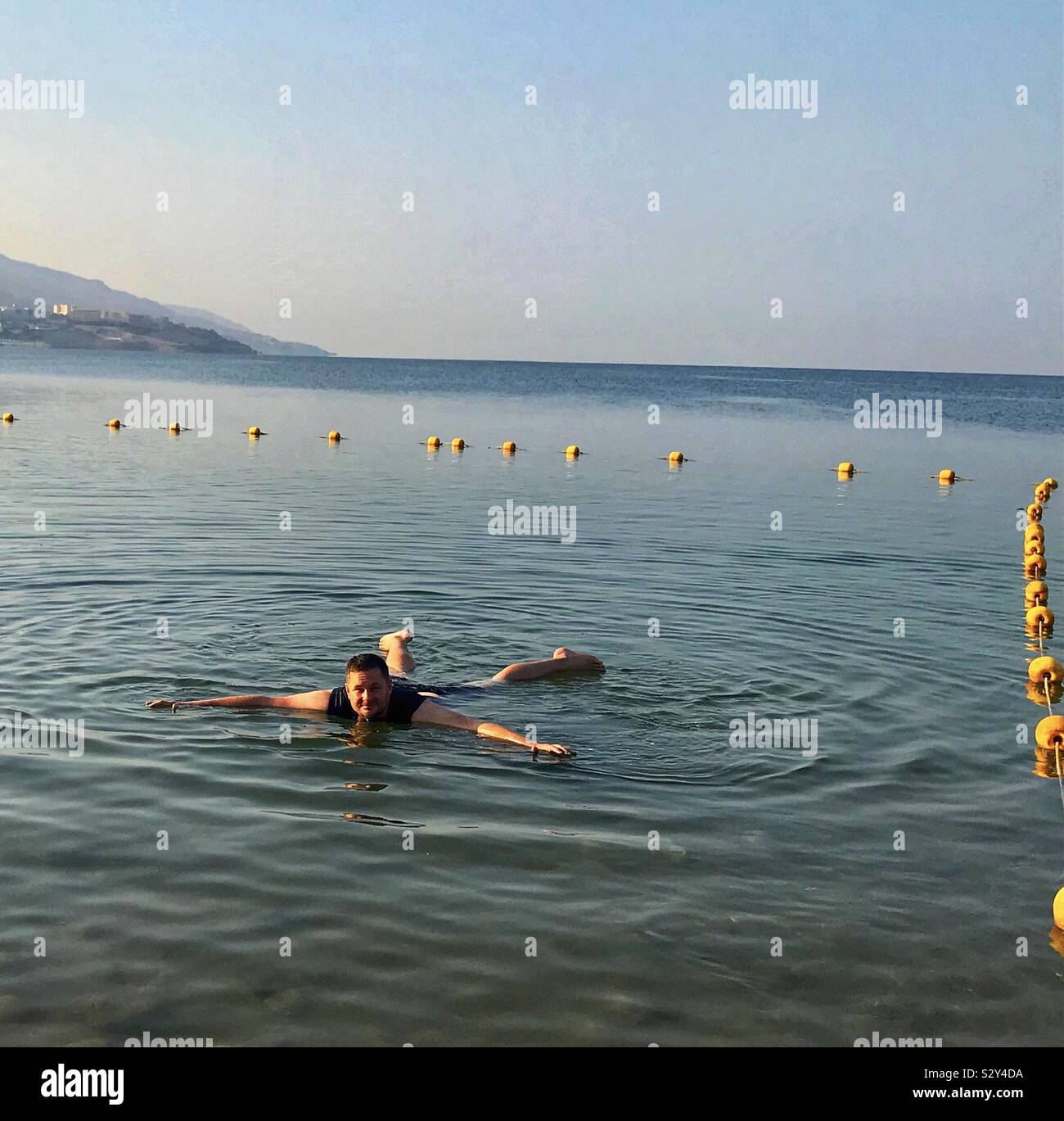 Floating in the Dead Sea Jordan Stock Photo