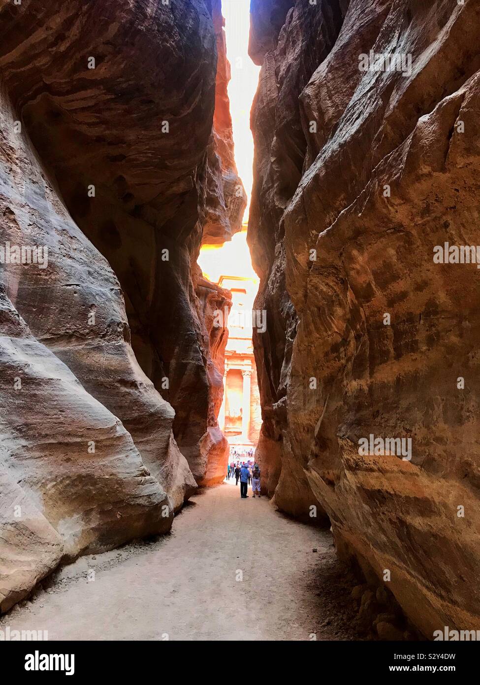 Walking through the siq to the treasury at Petra. Jordan. - Smartphone Captured Stock Image