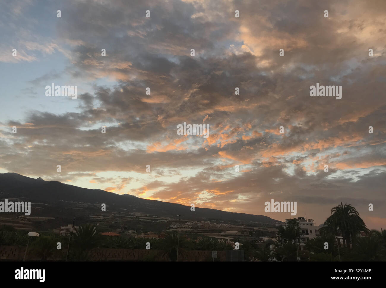 Red sky in the morning over the mountains in Tenerife, Canary Islands - Smartphone Captured Stock Image