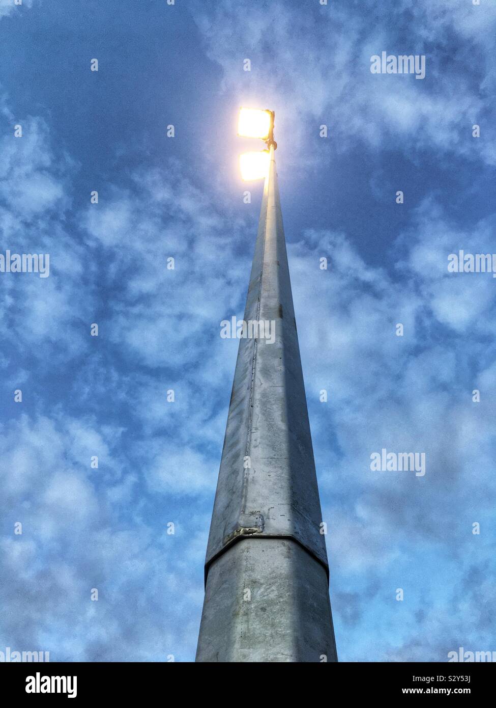 Sports field floodlights on a metal pole. - Smartphone Captured Stock Image