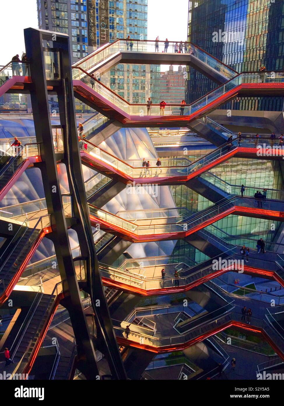 The honeycombed metallic viewing platform is called the vessel and is in Hudson yards, NYC, USA - Smartphone Captured Stock Image