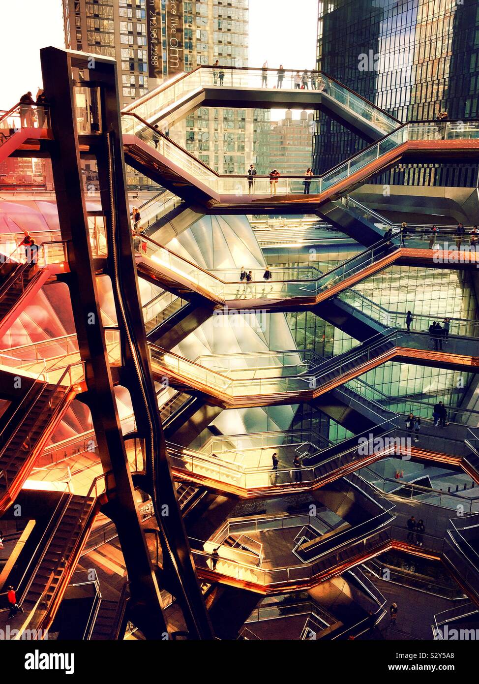 The vessel is a tourist attraction in Hudson yards which is copper clad and honeycombed, NYC, USA - Smartphone Captured Stock Image