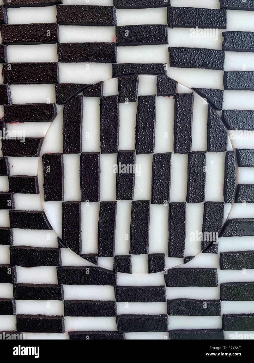 Black and white optical illusion cake frosting. - Smartphone Captured Stock Image