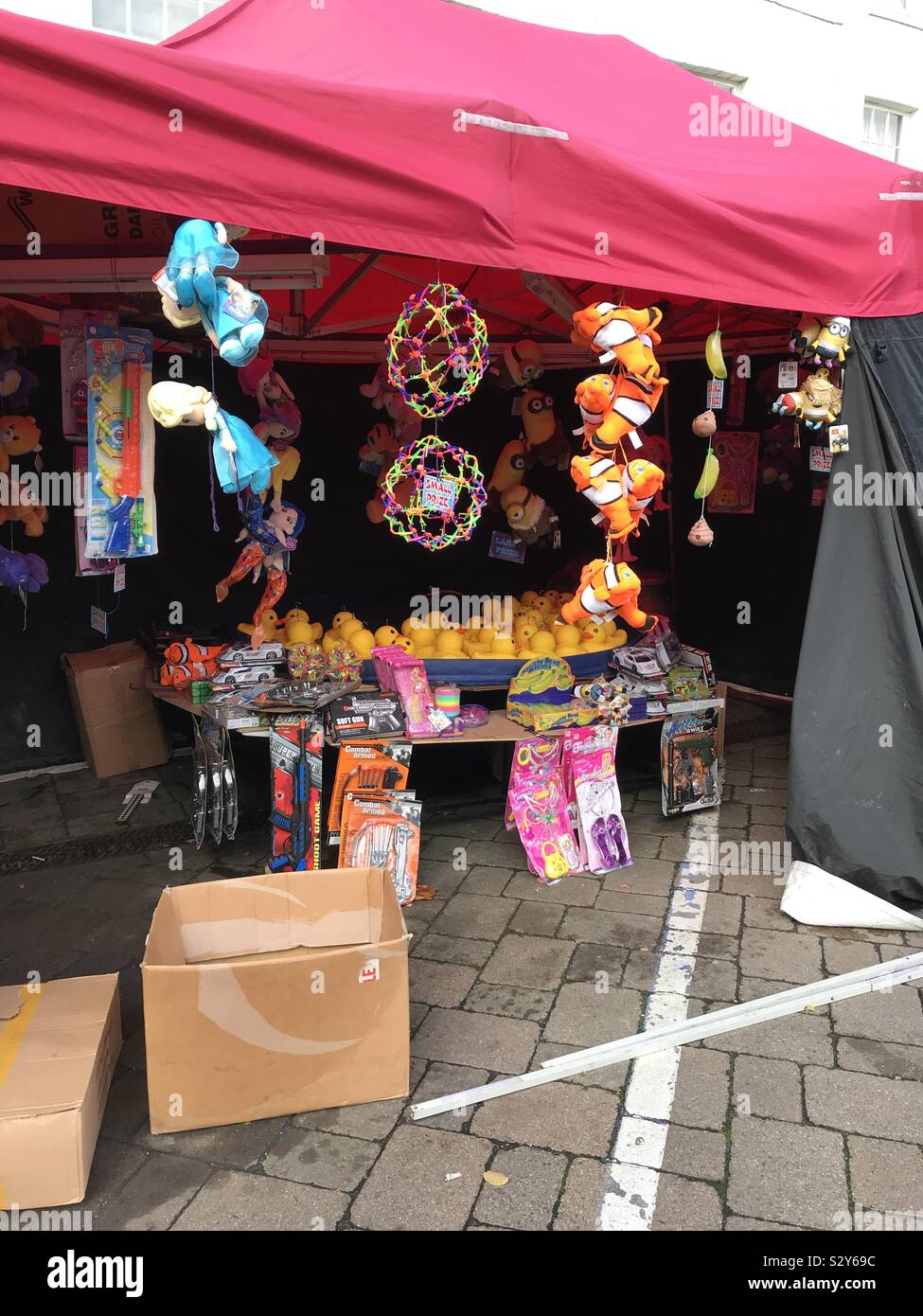 Hook a duck stall being set up ready at the funfair Stock Photo Alamy