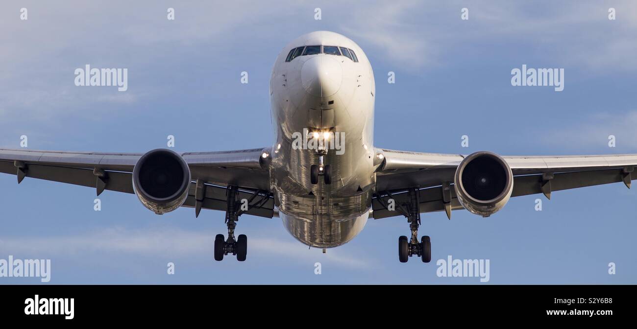 Passenger plane preparing to land in Osaka, Japan. Stock Photo
