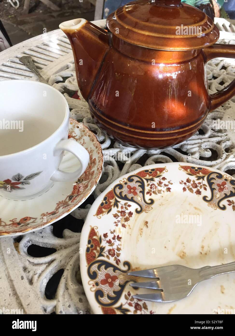 Finished afternoon tea brown tones teapot - Smartphone Captured Stock Image