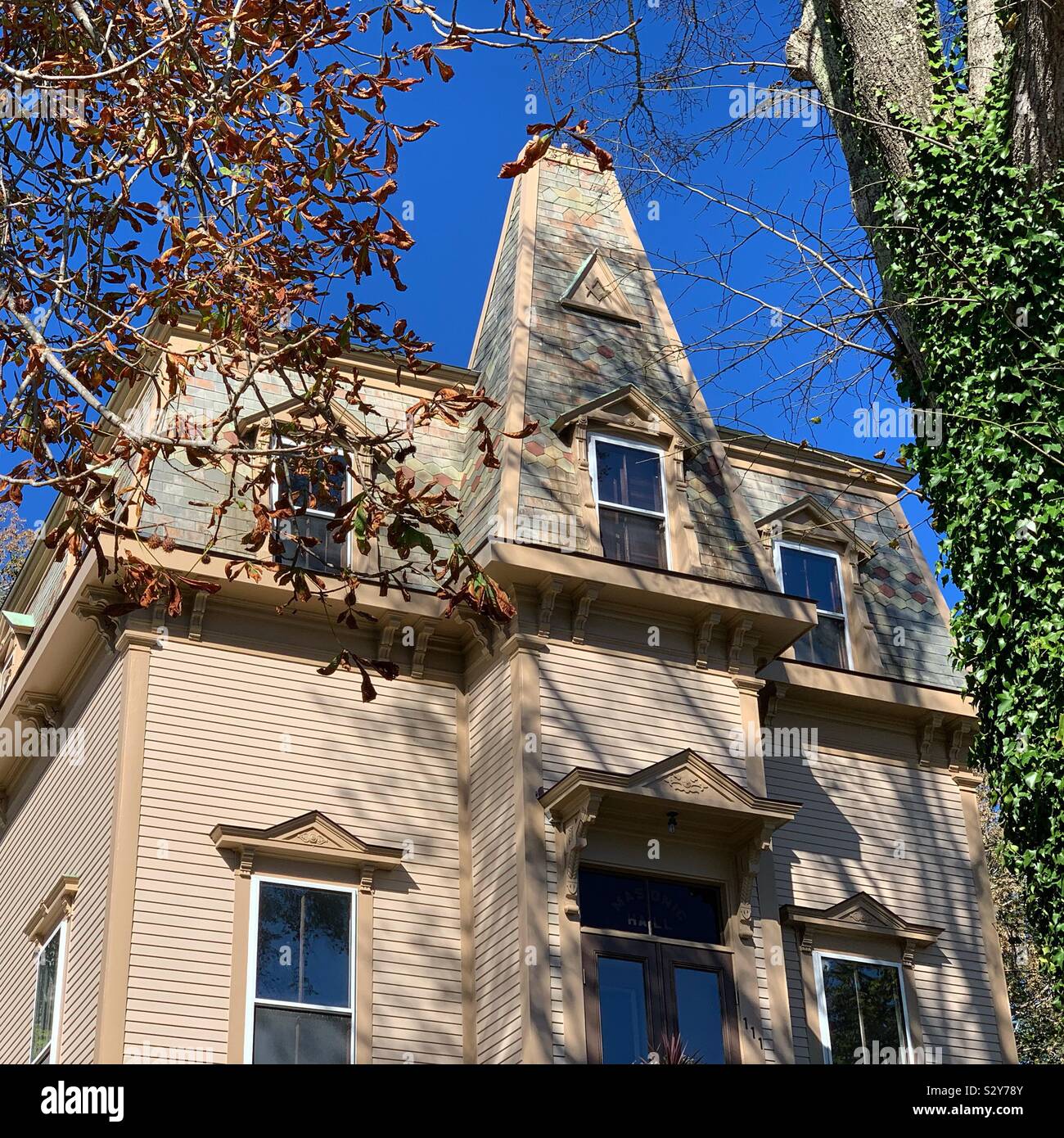 Autumn view of the mansard roof of the Adams Masonic Lodge, Wellfleet, Cape Cod, Massachusetts, United States - Smartphone Captured Stock Image