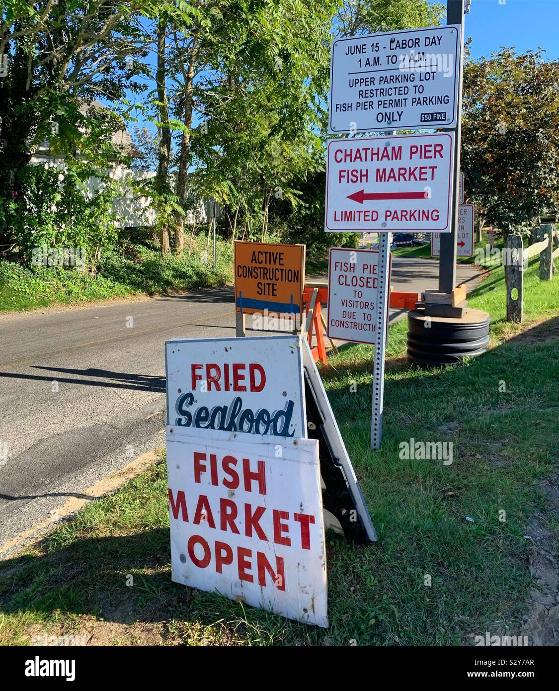Signs near the pier and fish market, Chatham, Cape Cod, Massachusetts, United States - Smartphone Captured Stock Image