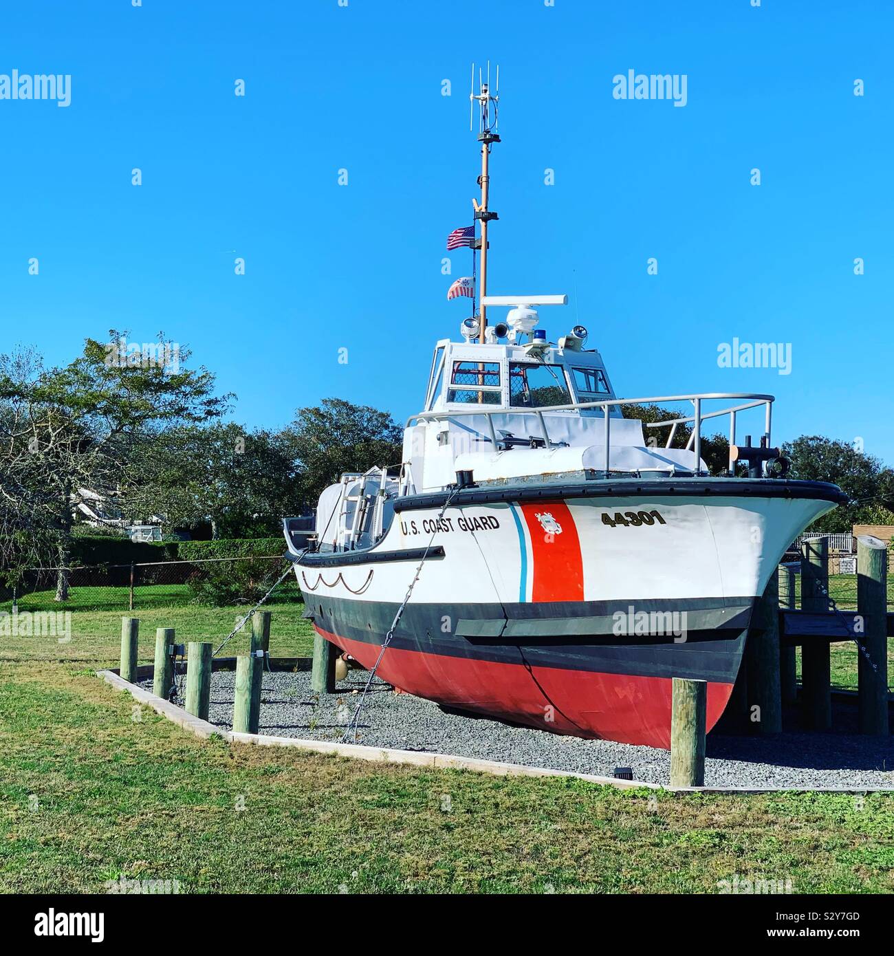 U.S. Coast Guard boat displayed next to Chatham Lighthouse, Chatham, Cape Cod, Massachusetts, United States - Smartphone Captured Stock Image