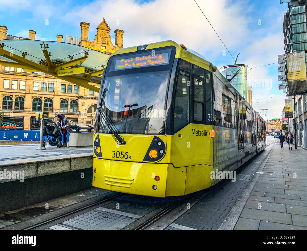 Metro link tram at Exchange Square tram stop in Manchester Stock Photo