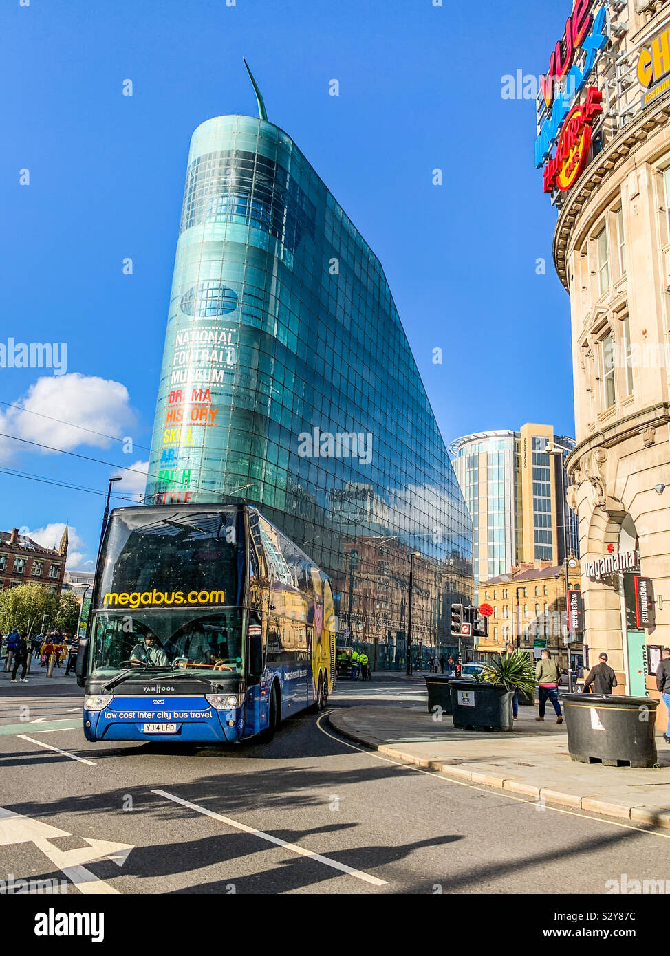 Megabus passing the National Football museum in Manchester - Smartphone Captured Stock Image
