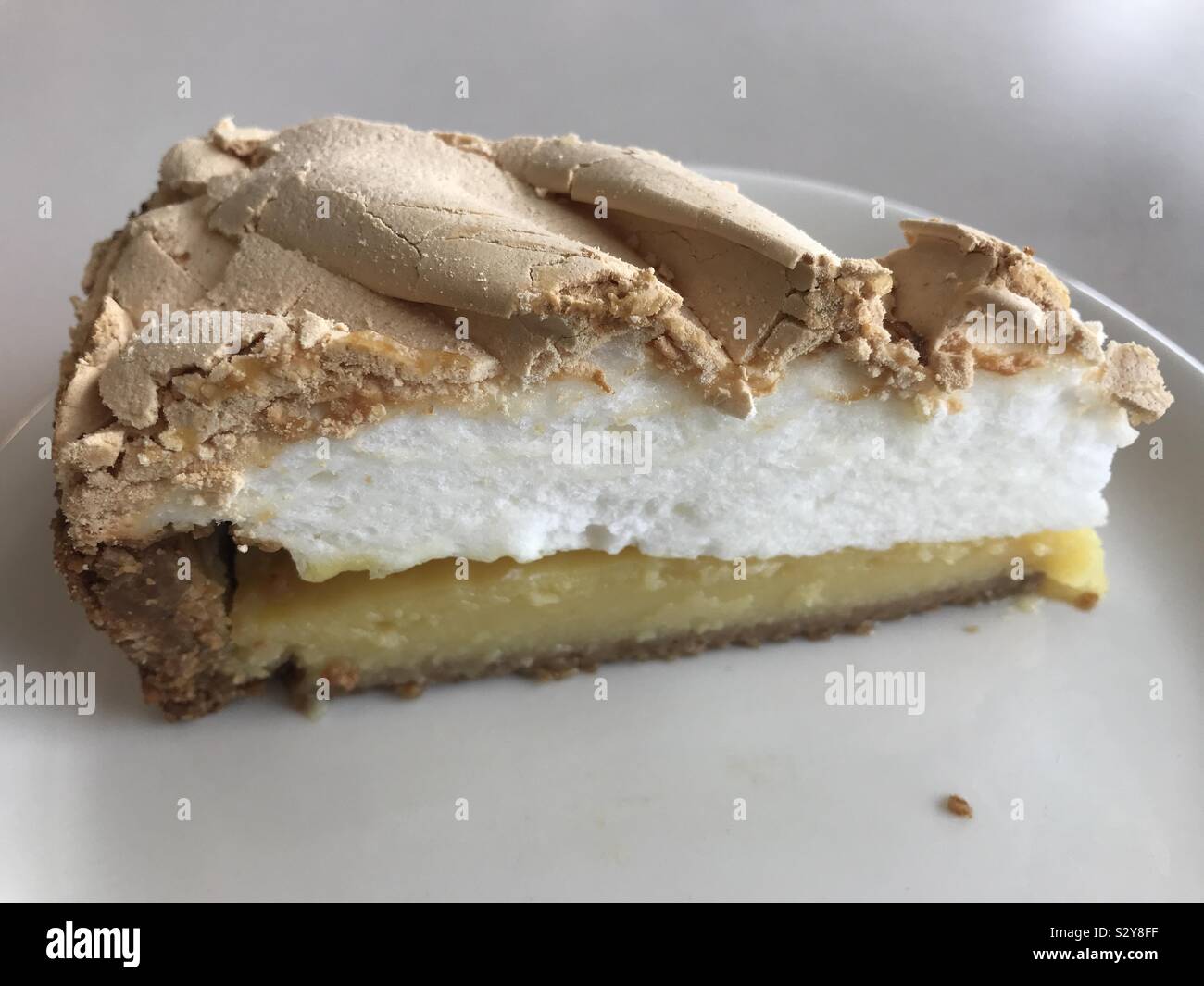 Slice of lemon meringue pie Stock Photo