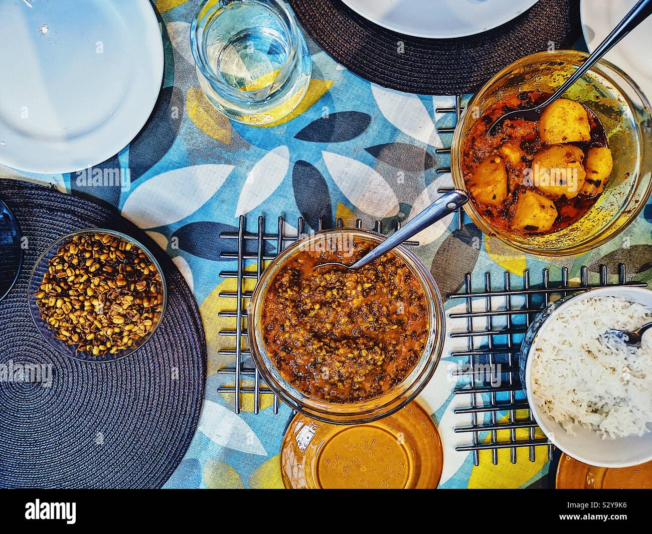 Elevated view of homemade Indian meal with bean sprouts, mung dal, potato curry and rice Stock Photo