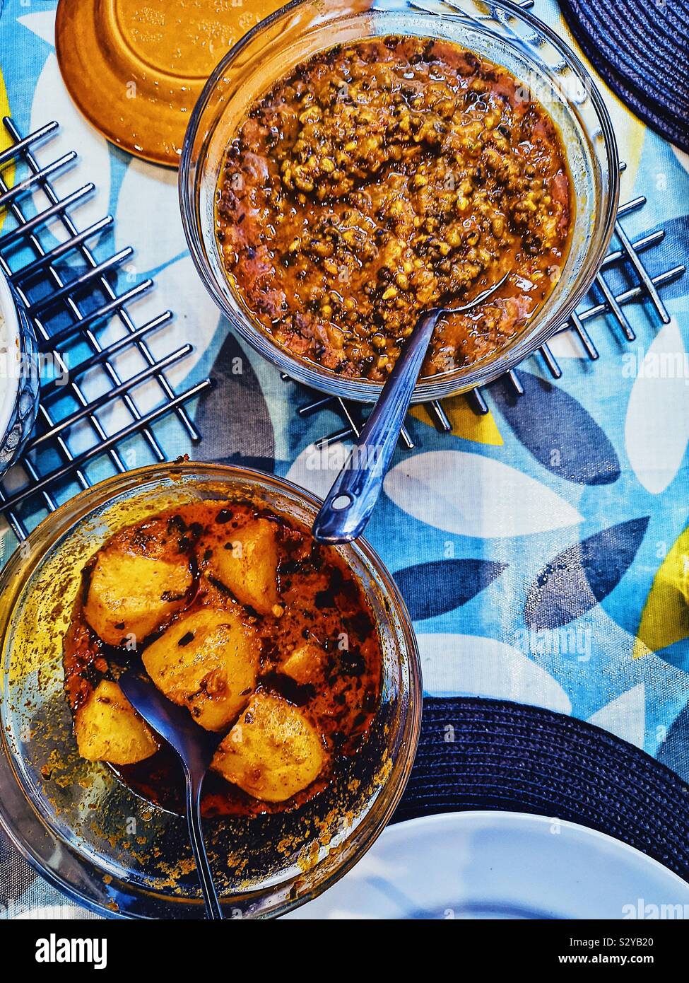 Elevated view of homemade Indian meal with mung dal and potato curry Stock Photo