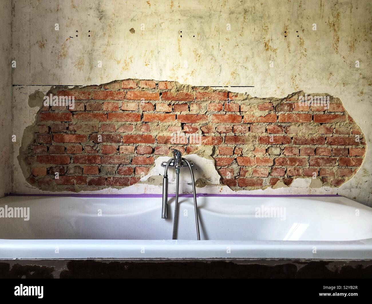 Bathroom remodeling with broken stucco - Smartphone Captured Stock Image