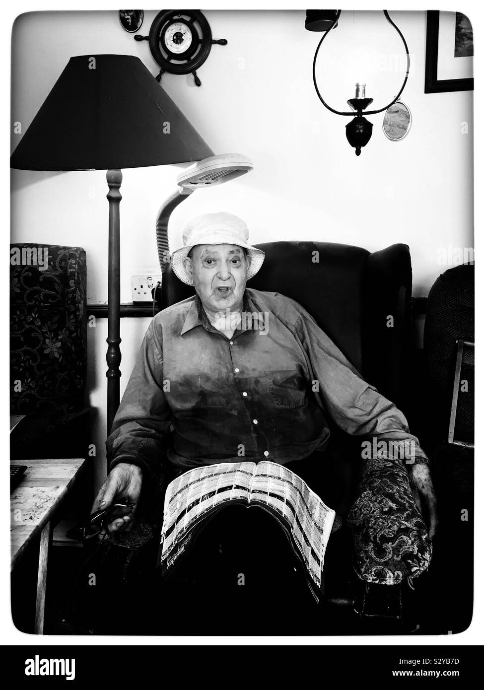 Old age pensioner at home during the long hot summer of 2018 - Smartphone Captured Stock Image