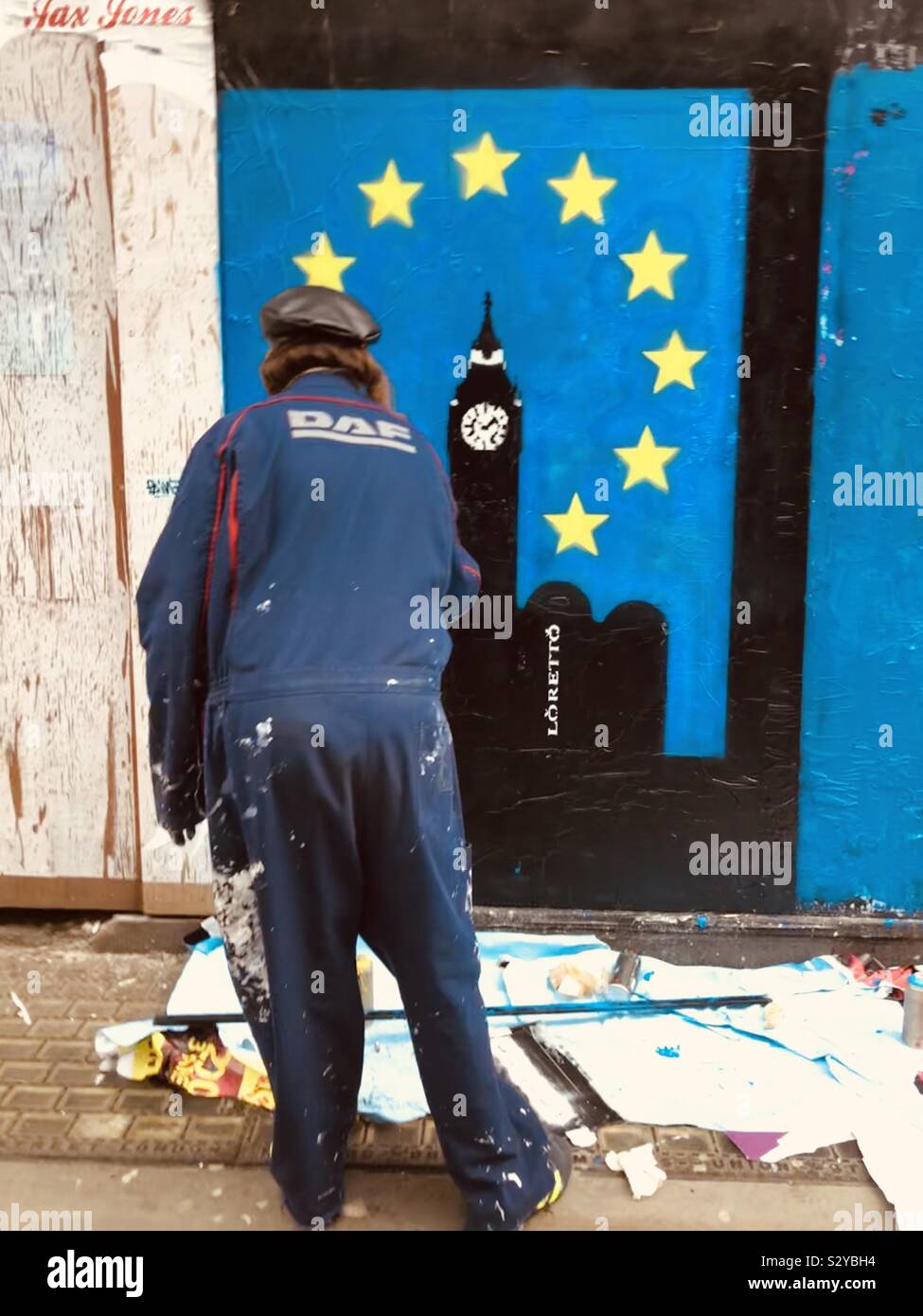 Graffiti artist painting Brexit graffiti Stock Photo