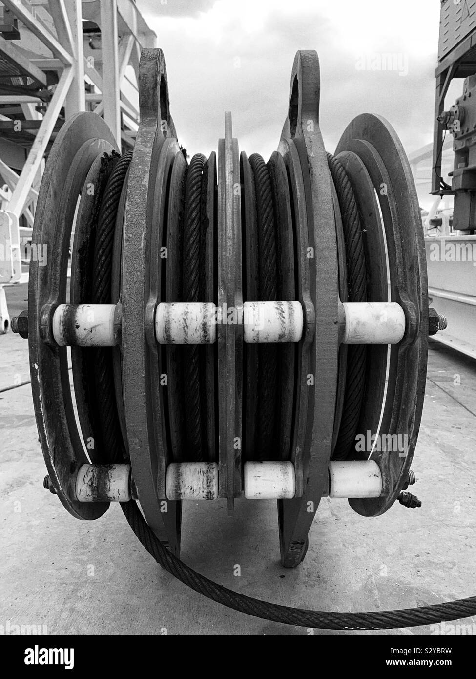 Crane rope or steel cable rolled up on a pulley - Smartphone Captured Stock Image