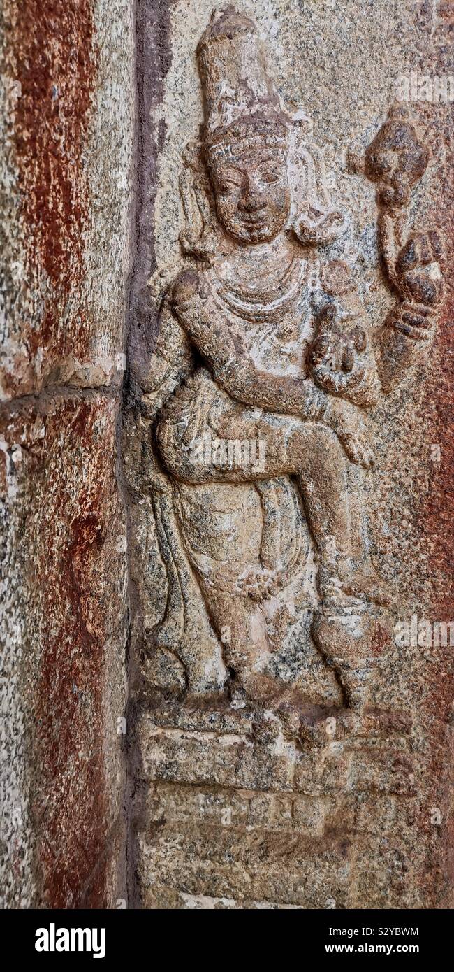 Wall reliefs in an old temple in Hanoi, India. - Smartphone Captured Stock Image
