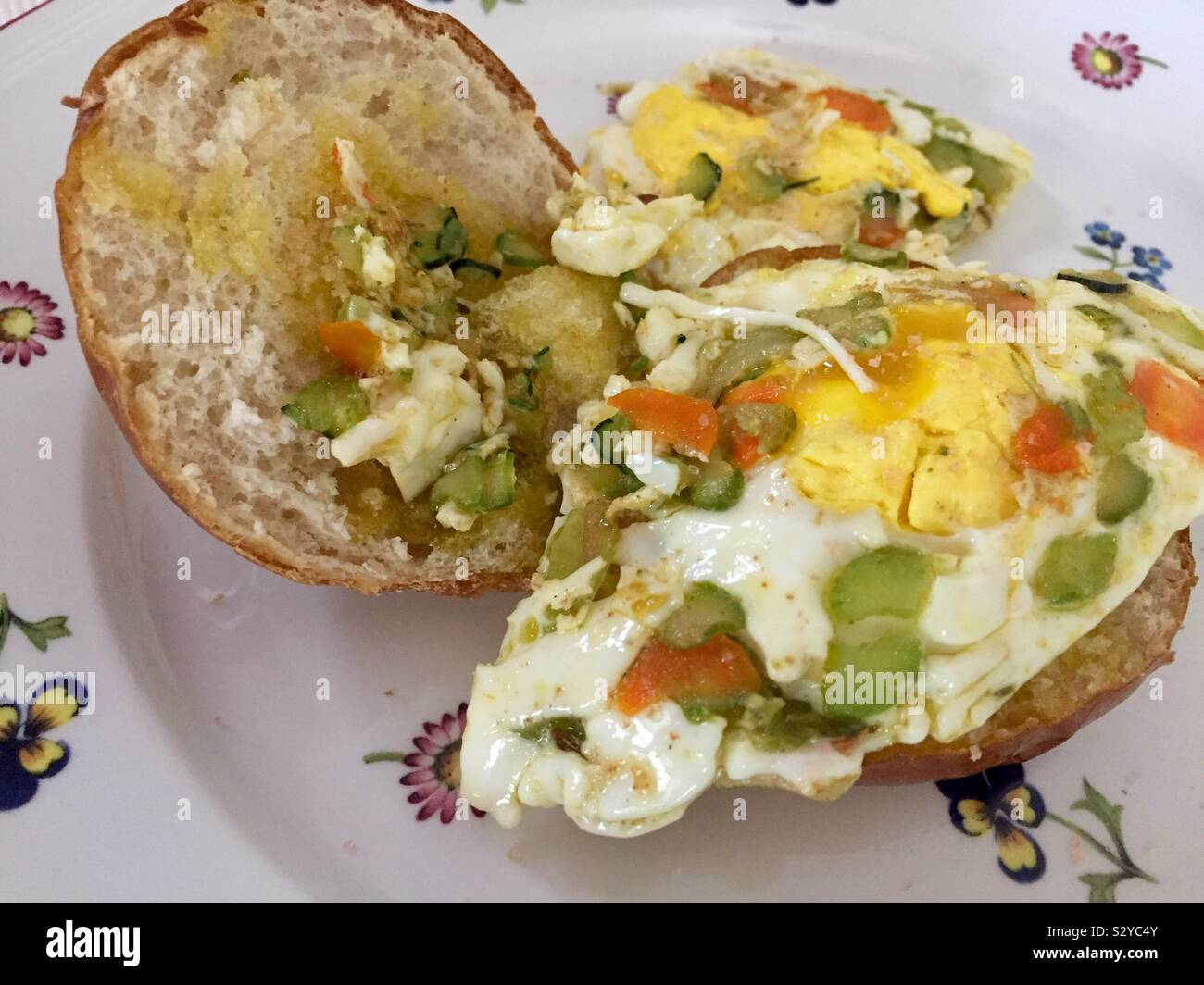 Eggs on a Pretzel bread bun Stock Photo