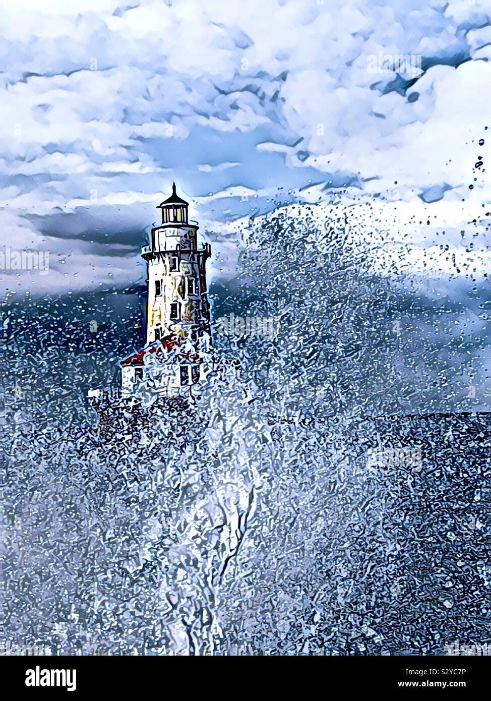 Lonely lighthouse withstanding heavy and string rough seas - Smartphone Captured Stock Image