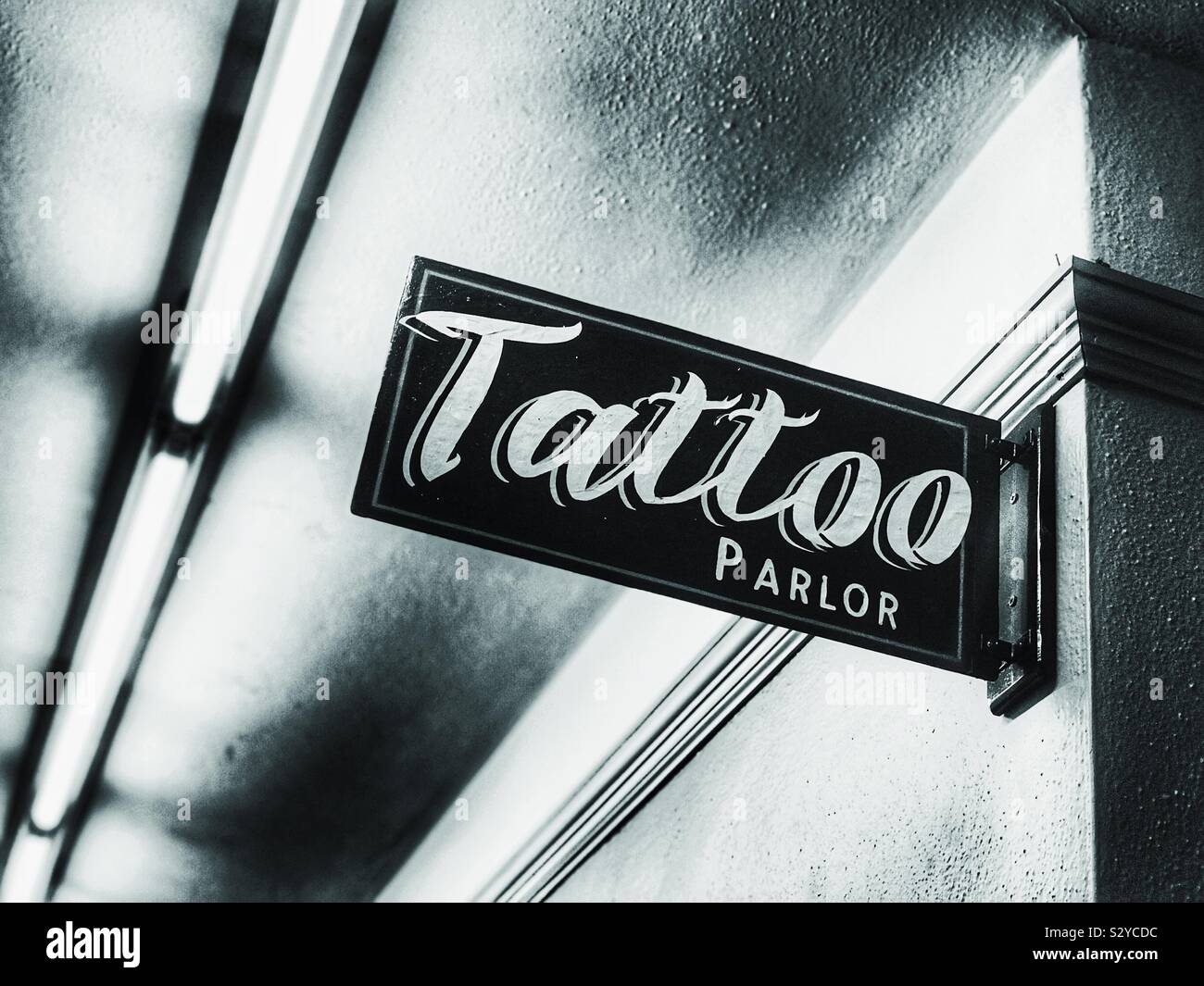 Tattoo parlor sign in an old building - Smartphone Captured Stock Image Tattoo parlor sign in an old building - Smartphone Captured Stock Image