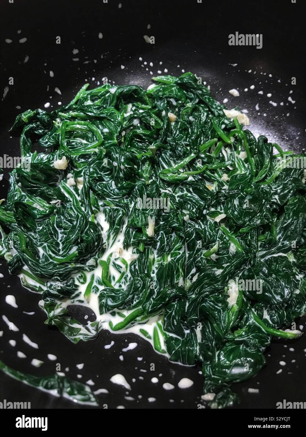 Creamed spinach with smoked garlic - Smartphone Captured Stock Image
