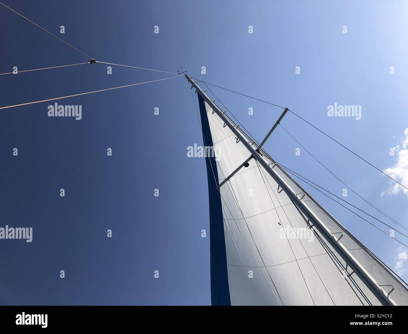 Sail of a sailboat against the sky. - Smartphone Captured Stock Image