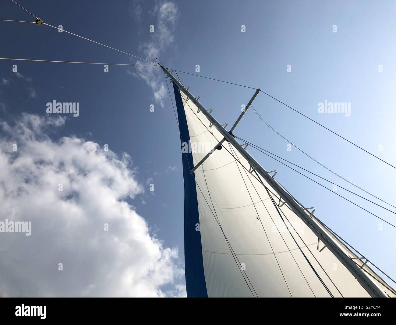 Sail of a sailboat against the sky. - Smartphone Captured Stock Image