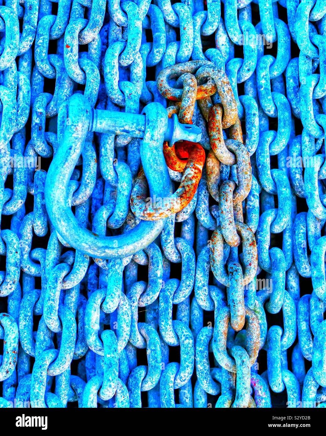 Blue hasp and rusty chains in a shipyard - Smartphone Captured Stock Image
