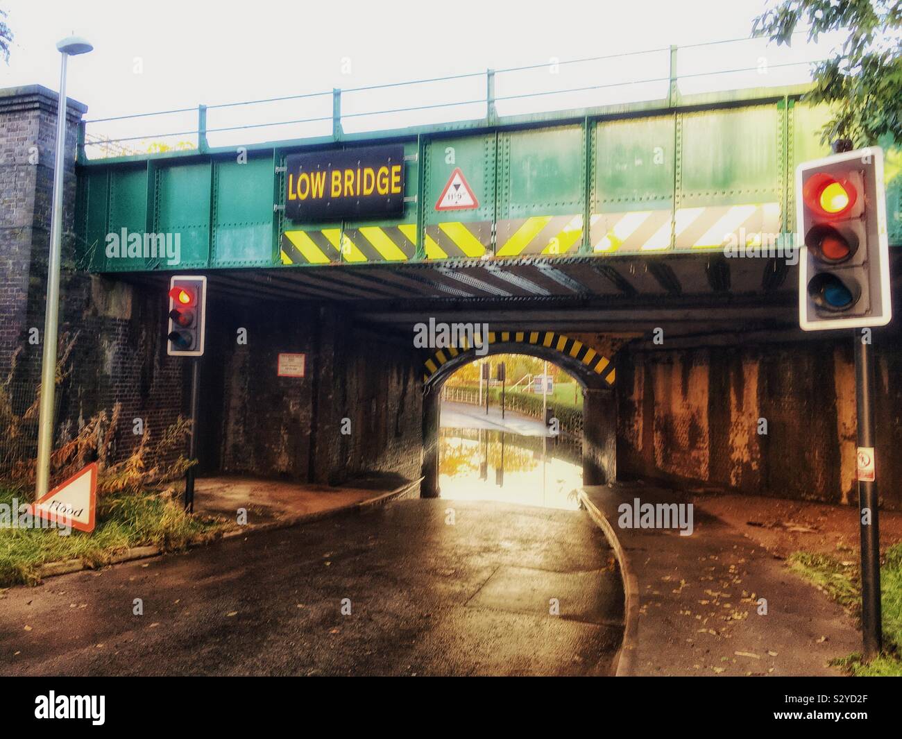 Flooded road under railway bridge Uk - Smartphone Captured Stock Image