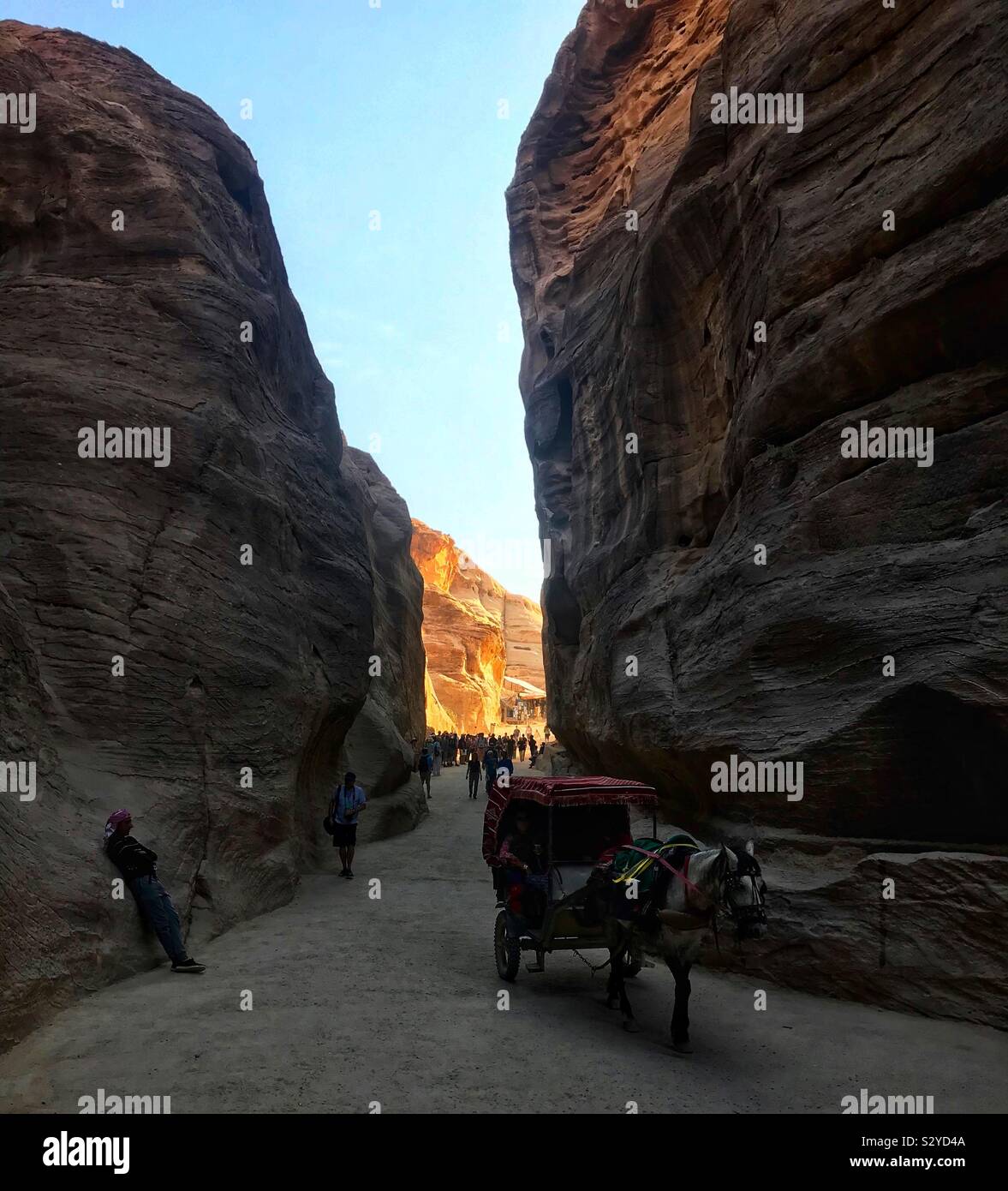 Walking through the siq at Petra. Jordan Stock Photo