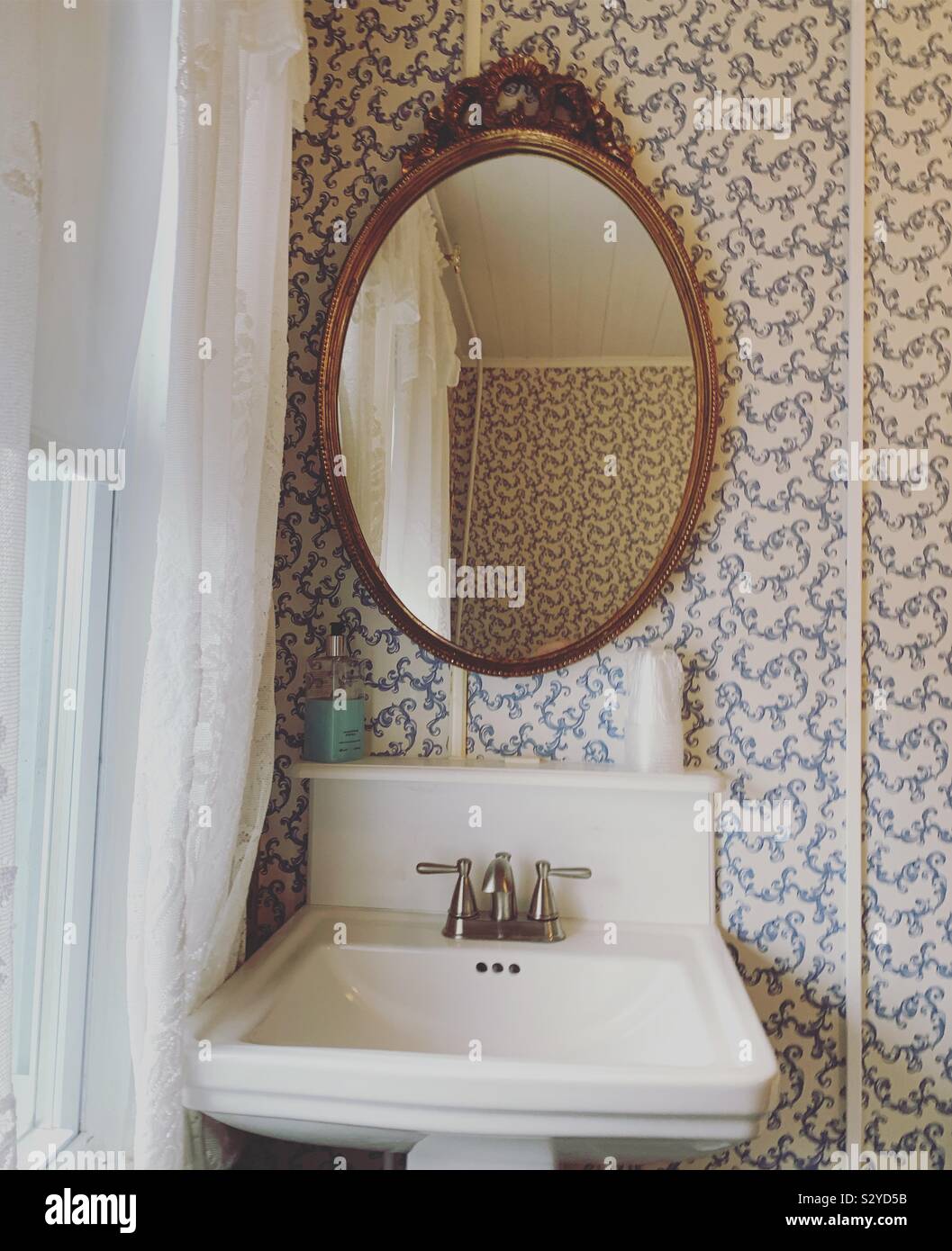 Sink and mirror in a guestroom at Lillagaard Bed and Breakfast, Ocean Grove, Neptune Township, Monmouth County, New Jersey, United States - Smartphone Captured Stock Image