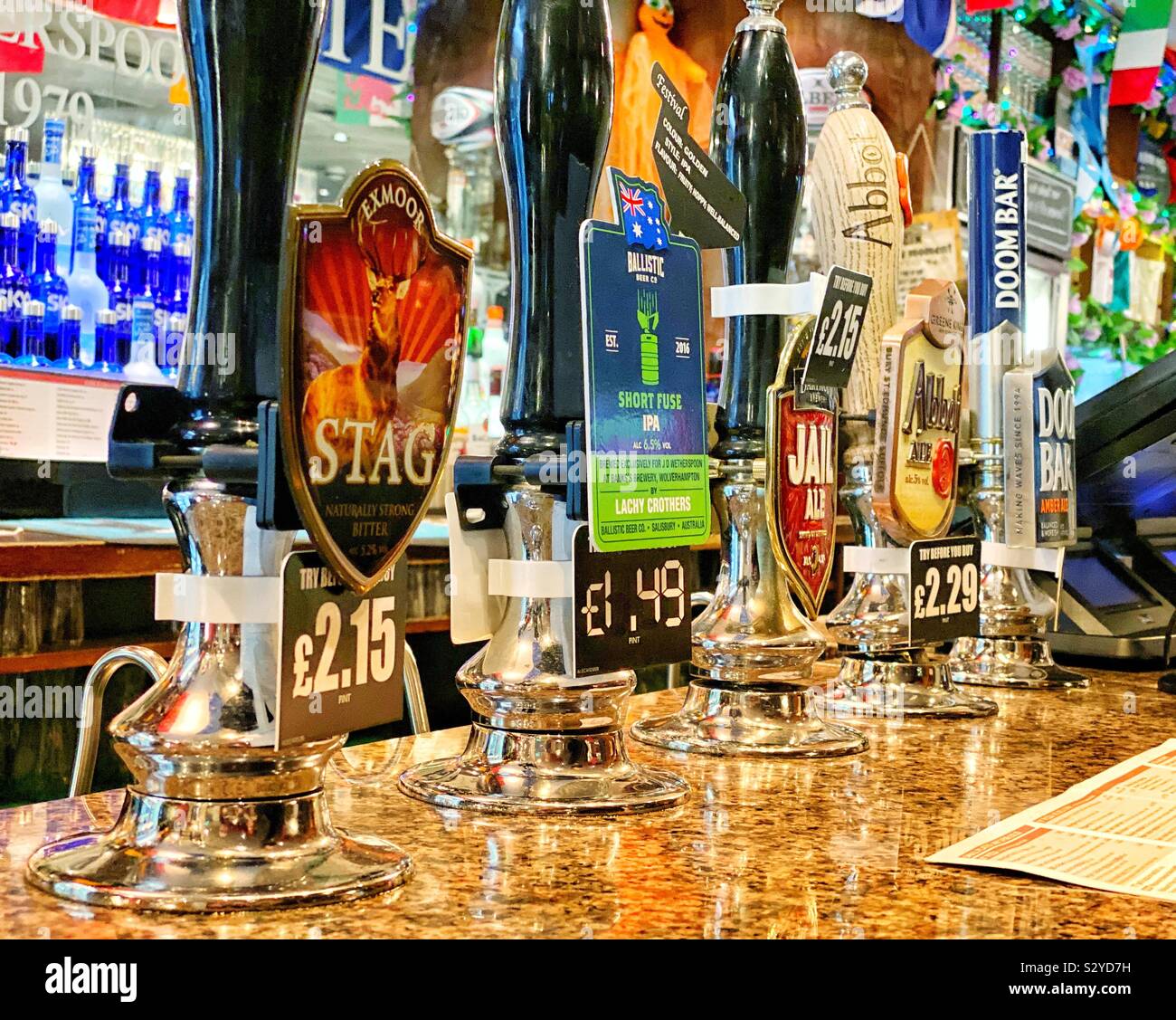 Beer taps in a Weatherspoon’s pub Stock Photo