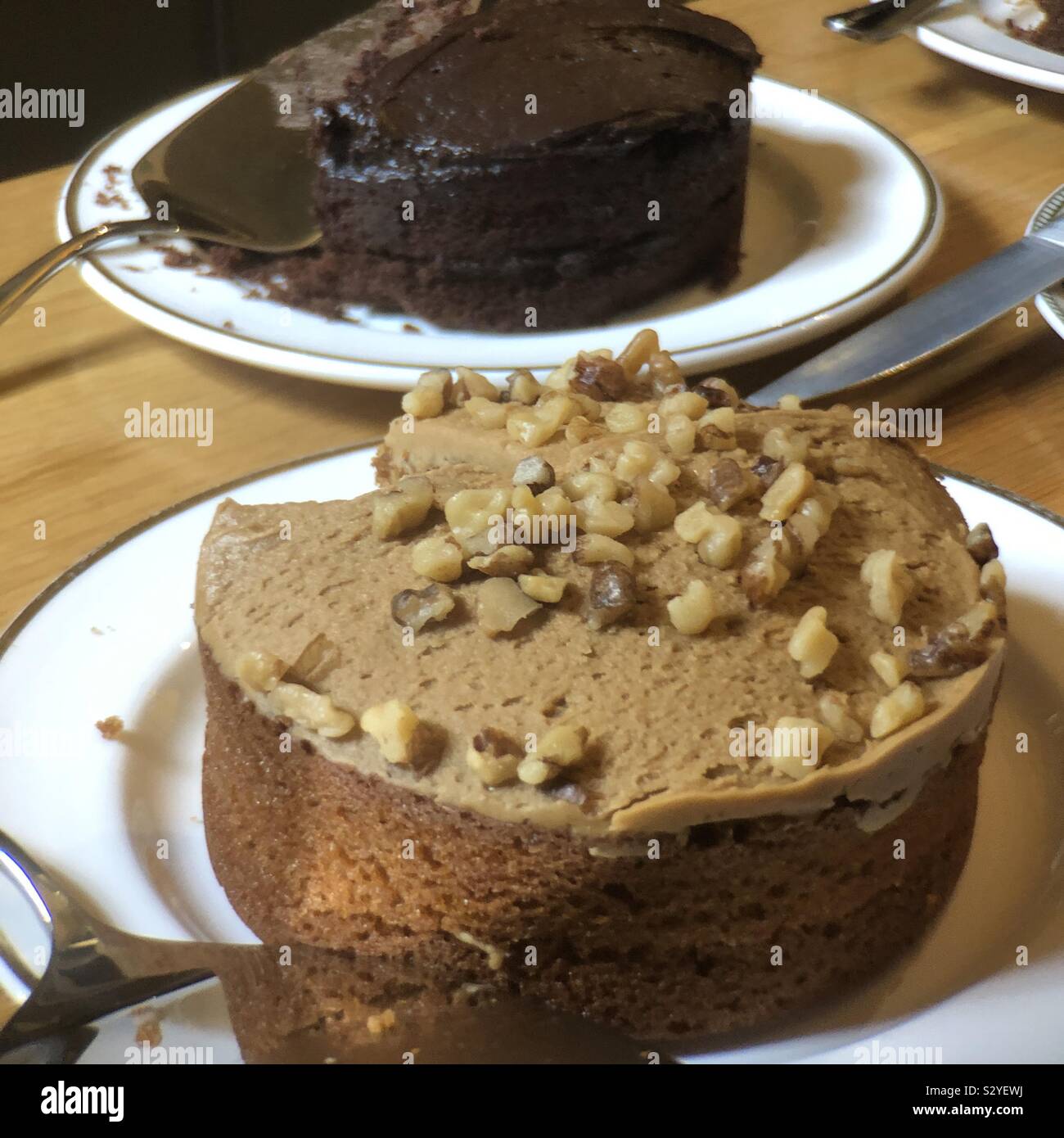 Ginger carrot and chocolate cakes with a slice taken - Smartphone Captured Stock Image