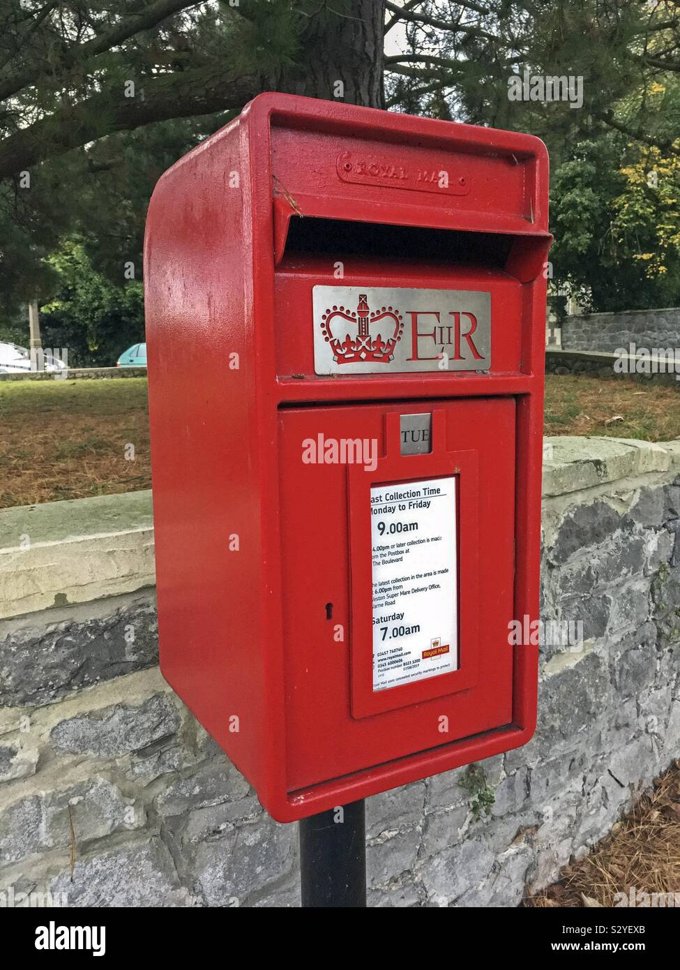 A modern lamp box type postbox in Weston-super-Mare, UK - Smartphone Captured Stock Image