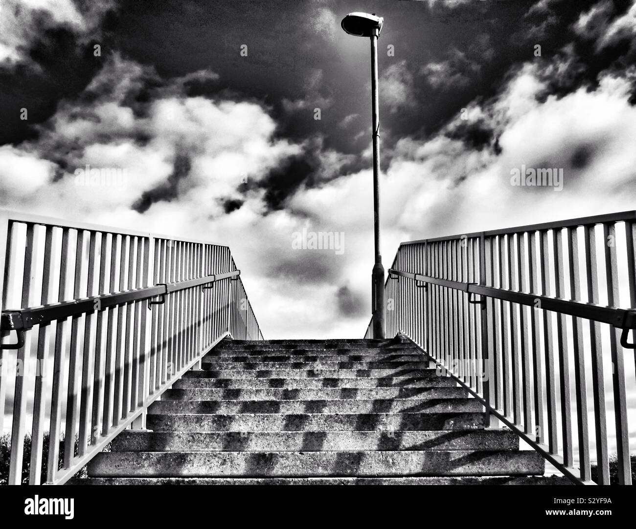 Concrete stairway rising to a street lamp post , Scotland, UK - Smartphone Captured Stock Image