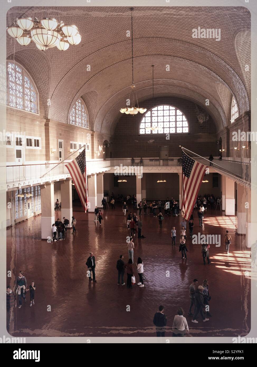 The registry at the Ellis Island national Memorial served as a welcoming and processing center for hundreds of thousands of immigrants in the 1900s, NYC, USA - Smartphone Captured Stock Image