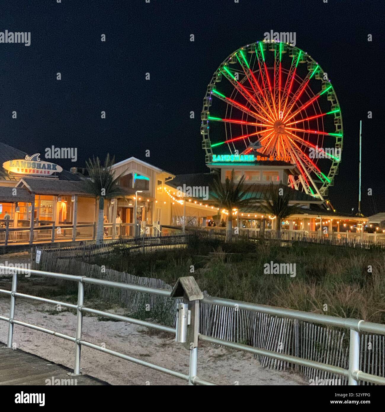 A nighttime view of The Wheel at the Steel Pier, Atlantic City Boardwalk, Atlantic City, New Jersey, United States - Smartphone Captured Stock Image