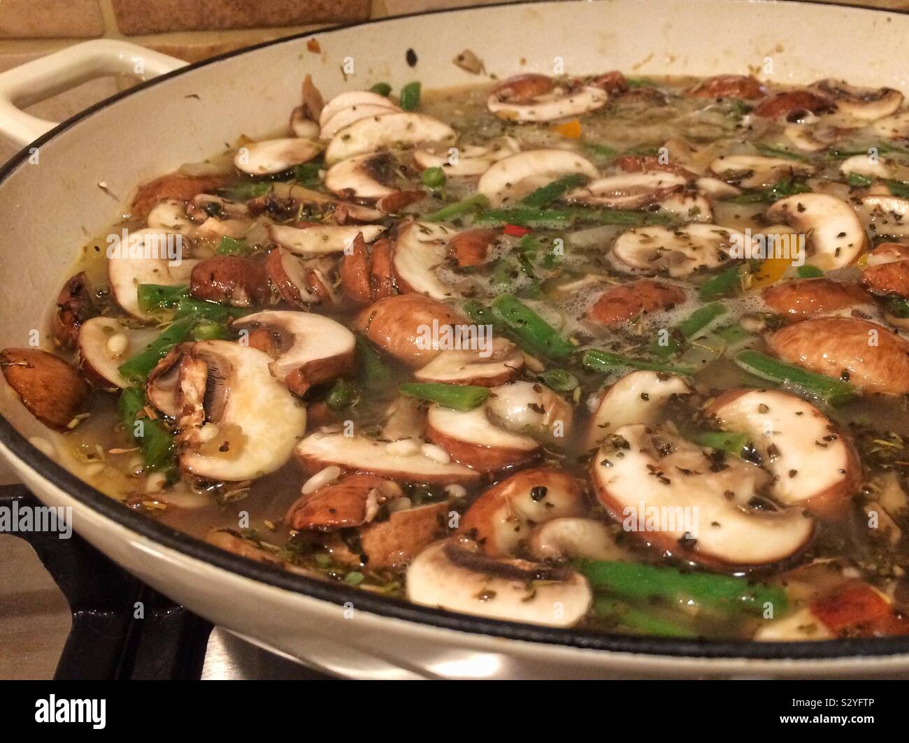 Mushroom and green bean risotto Stock Photo Alamy