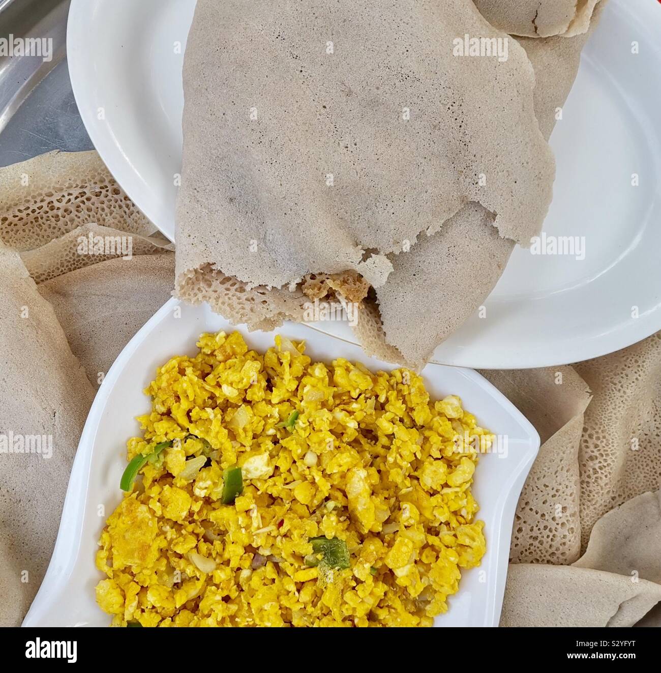 Enkulal be tibs firfir is a traditional Ethiopian breakfast. - Smartphone Captured Stock Image