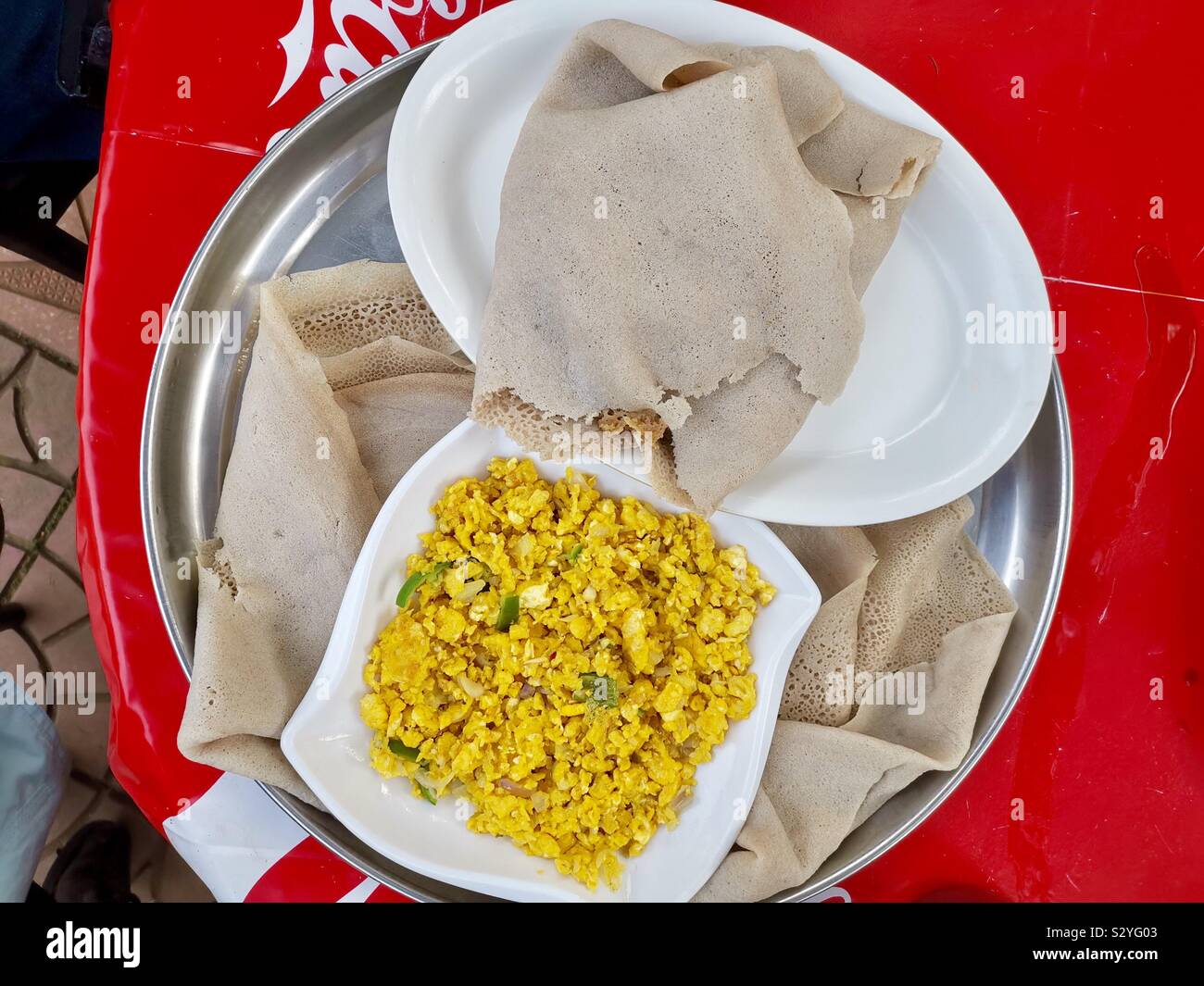 Enkulal be tibs firfir is a traditional Ethiopian breakfast. - Smartphone Captured Stock Image