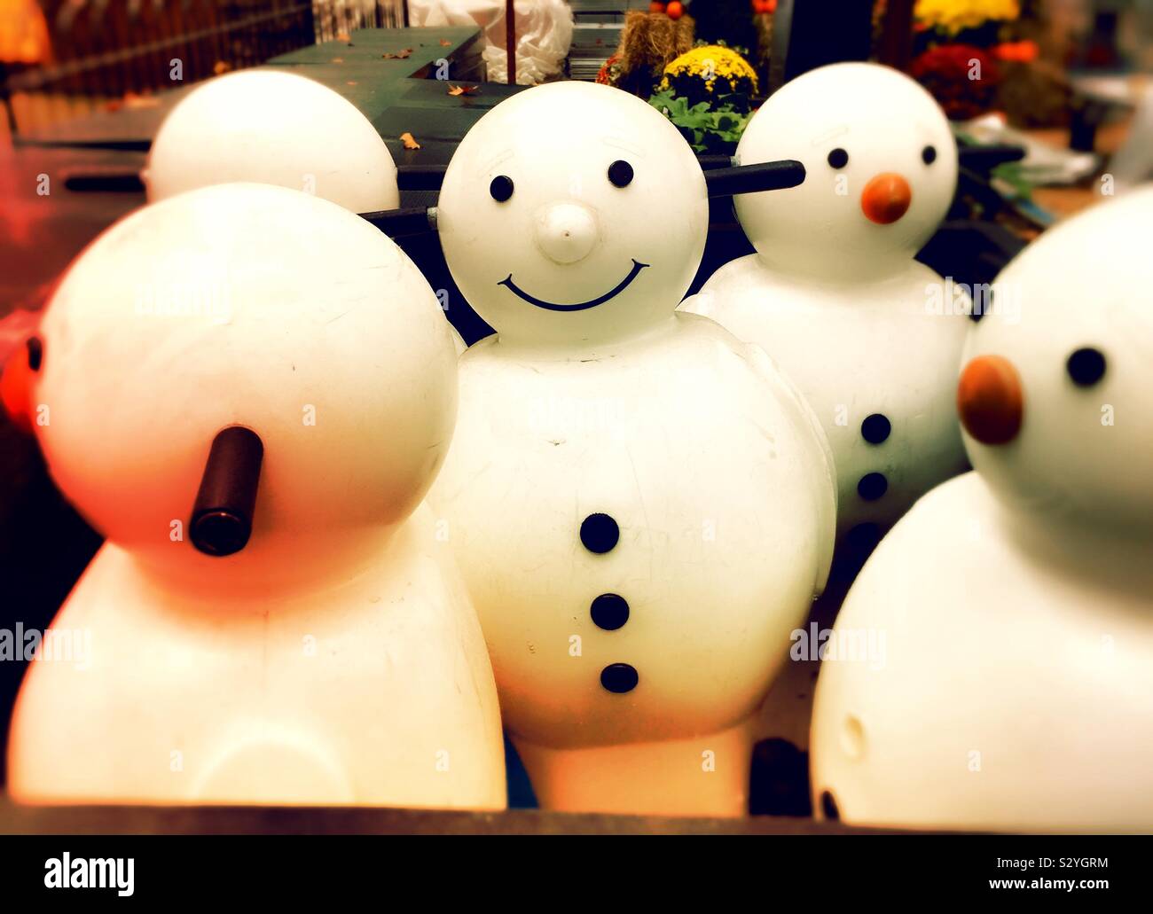 Snowman shaped ice-skating helpers in a storage bin next to an ice rink, USA - Smartphone Captured Stock Image
