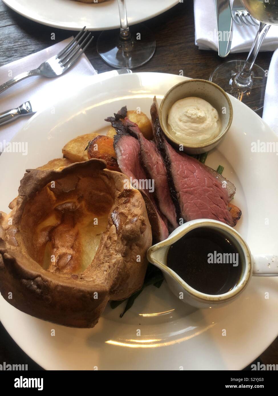 Roast beef dinner with Yorkshire pudding and gravy Stock Photo Alamy