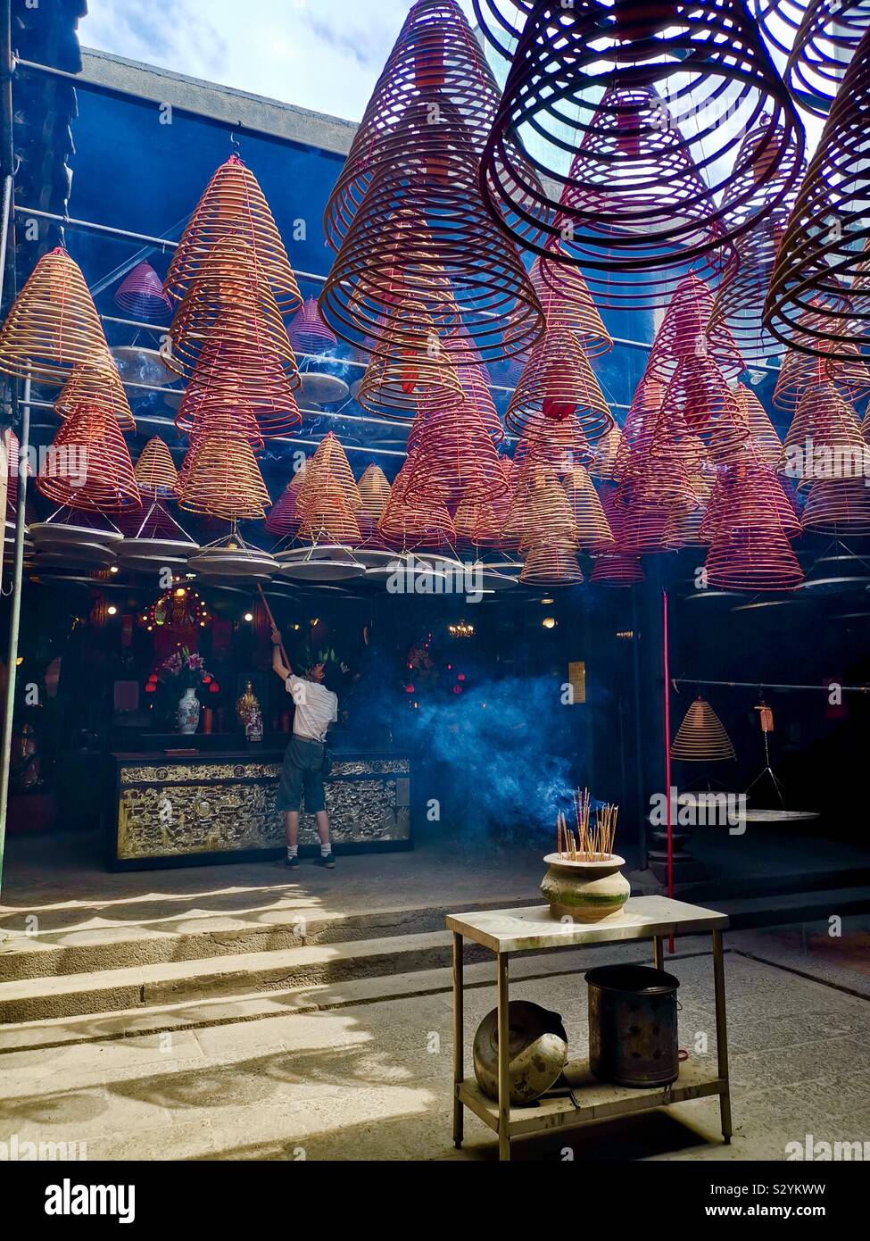 Spiral incense coils at Yaumatei Tin Hau Temple in Kowloon, Hong Kong. - Smartphone Captured Stock Image