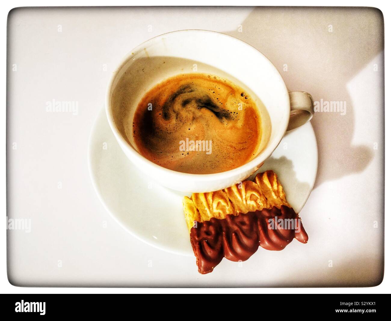 Black coffee and M&S Dutch shortcake biscuit - Smartphone Captured Stock Image