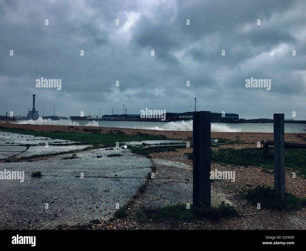 Shoreham-by-Sea harbour in stormy winter weather, gale force winds creating rough breaking waves, southern England, UK Stock Photo