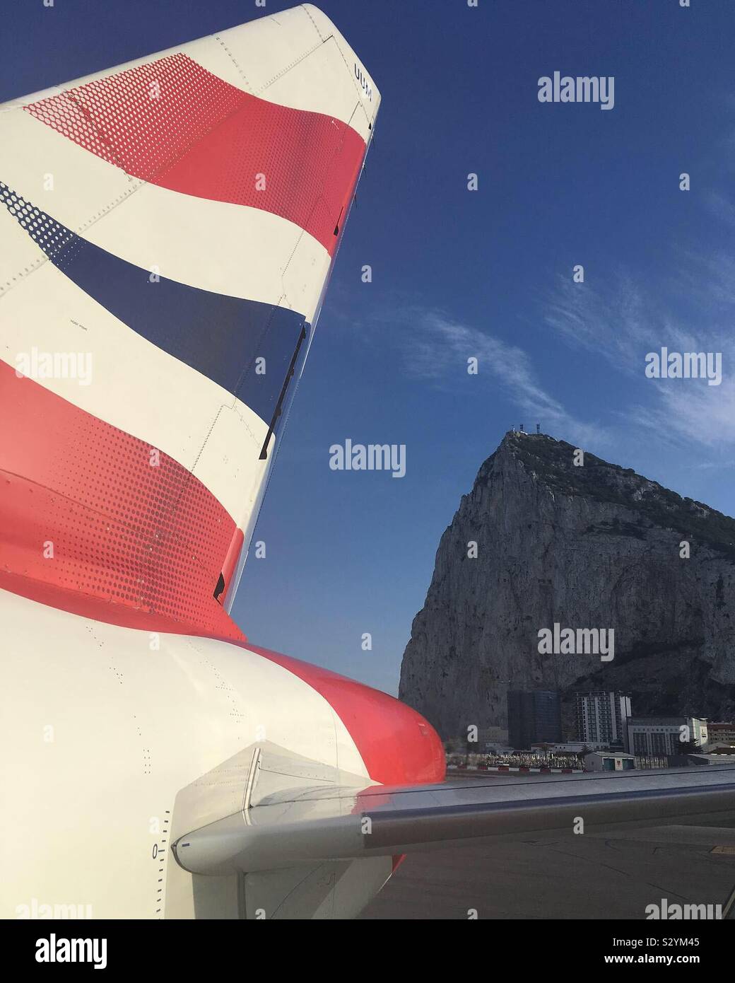 British Airways Airbus 320 outside of Gibraltar Airport with the Rock of Gibraltar behind Stock Photo