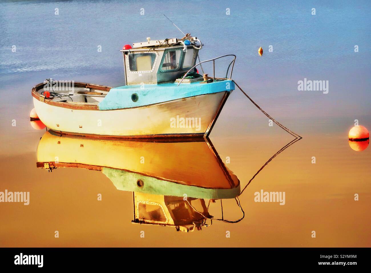 Small boat in the morning sun, Irvine harbour, Ayrshire, Scotland, UK - Smartphone Captured Stock Image