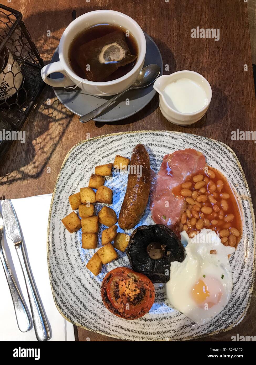 A full English breakfast at a restaurant. - Smartphone Captured Stock Image